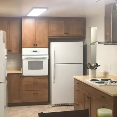 Furnished kitchen with two refrigerators at Malad Student House. Ideal off-campus housing for Boise State students.
