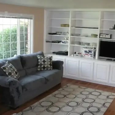 Furnished living room with built-in shelving at Malad House. Premium off-campus Boise State student housing near BSU.