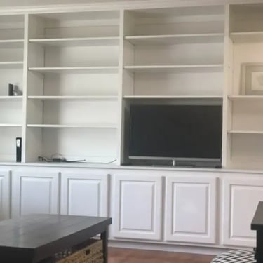 Living room built-ins and TV at Malad House, providing premium off-campus Boise State student housing near the BSU campus.