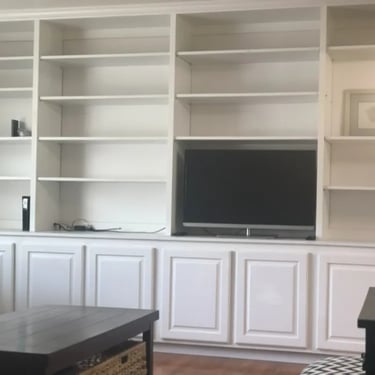Living room built-ins and TV at Malad House, providing premium off-campus Boise State student housing near the BSU campus.