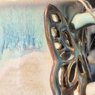 Side-by-side test: Gold lustre pottery after 100 dishwasher cycles showing faded, dull finish.
