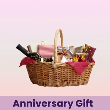 Luxury anniversary gift basket with a bottle of wine and wrapped presents in a wicker hamper.