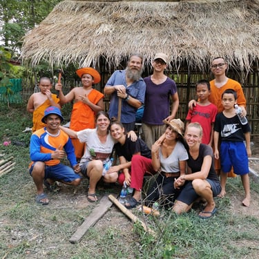 Group of Volunteers and Monks Helping at the Orphanage