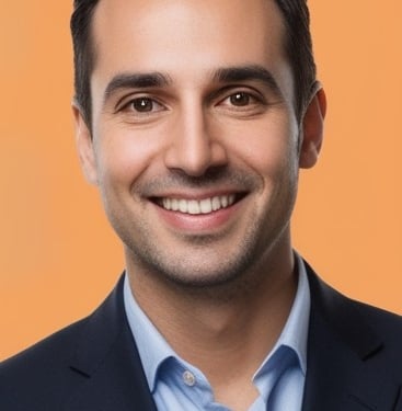a man in a suit and tie smiling