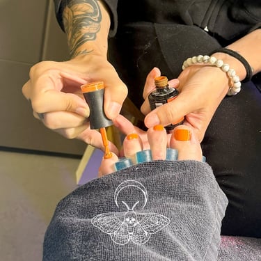 Full expert feet pedicure by The Nail Witchery in Missoula with orange gel toe nail polish
