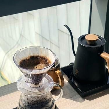 A beautiful coffee setup with Hario V60 dripper and a gooseneck electric kettle