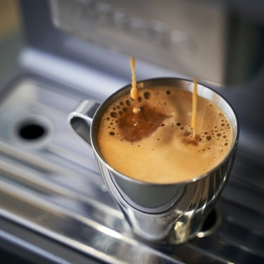 A close-up view of a espresso shot pulled from a coffee machine