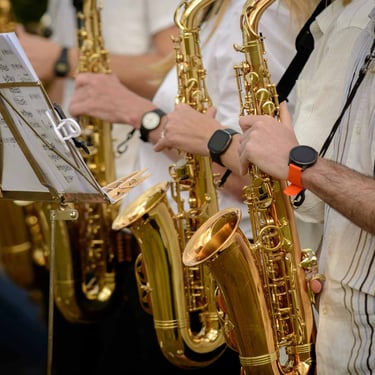 A close up picture of a group of musicians that play on saxophones. Author: Slawek Dejneka