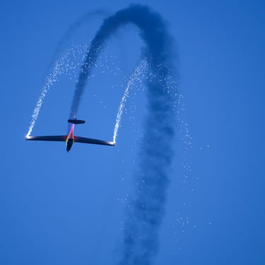 A plane making making a turn during the Duxford night air show
