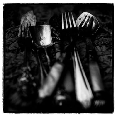 An abstract photography of silver cutlery. Author: Slawek Dejneka