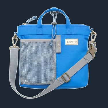 A lightweight, packable, and foldable tote with a simple, rectangular shape and a zip top.