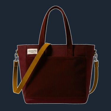 A simple, yet structured north-south tote with a clean, open-top design. The hard-finish canvas gives it a defined shape.