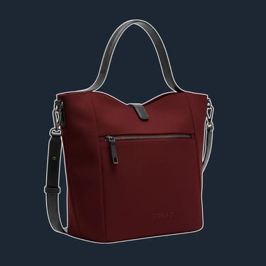 A minimalist and structured tote with a curved top line and a flat, stable base. Its form is clean and sculptural.