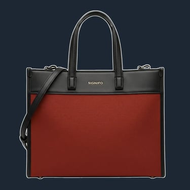 A structured, east-west tote with rectangular silhouette. The top edge and side seams are framed with leather trim