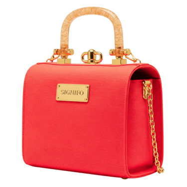 A rigid, boxy, 'lunchbox' style tote with a curved top and a structured, self-supporting form.