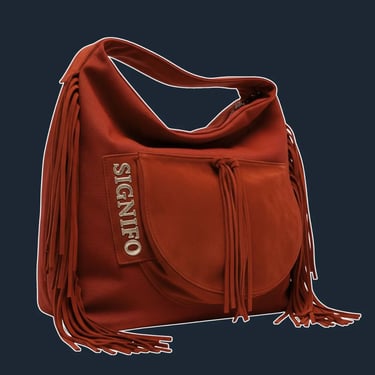 A large, soft, and unstructured 'hobo' or 'slouch' bag that drapes beautifully from the shoulder.