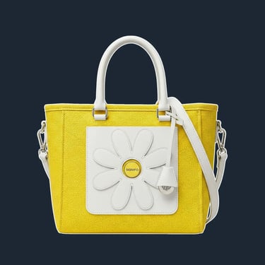 A structured, boxy tote with a clean, simple silhouette, reminiscent of 60s handbag shapes.