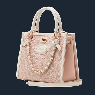 A structured, top-handle tote with a classic 'lady bag' silhouette and delicate, accordion-style side gussets.