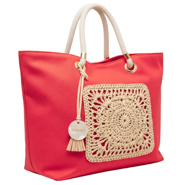 A soft, unstructured, and spacious 'boat' tote with a wide, open top, perfect for a beach day.