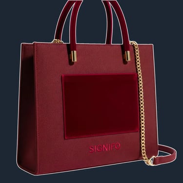 A sleek, minimalist, rectangular tote with clean lines and an almost seamless appearance.