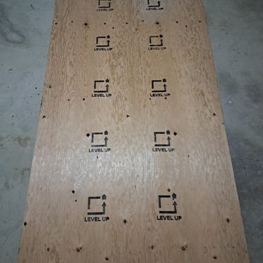 Custom-branded plywood panel with Level Up logo for use in professional renovation and subfloor installations