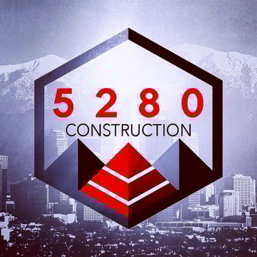 Logo with mountains and traffic cones for a construction business in Colorado
