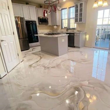 Modern kitchen featuring a high-gloss white and grey marbled epoxy floor with a central island.