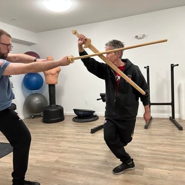 Instructors practicing with Jian vs. Miaodao