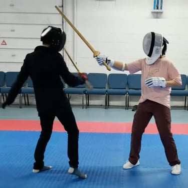 Twos students working on half speed sparring with the Jian