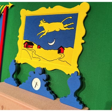 A punch needle cow jumps over the moon in Goodnight Moon - A Fiber Tale by Dundee & Lee artists Emilie Odeile & Ken Chapin.