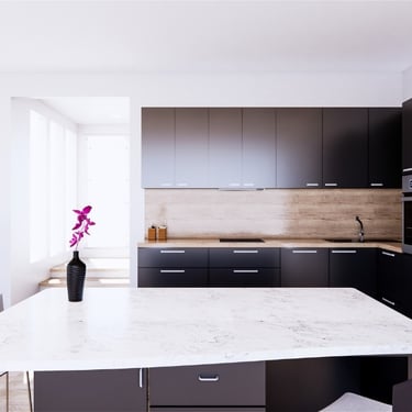 Reforma de cocina moderna con isla central en Valencia realizada por Reformistas Valencia
