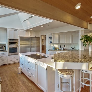 a kitchen with a large island and a large island