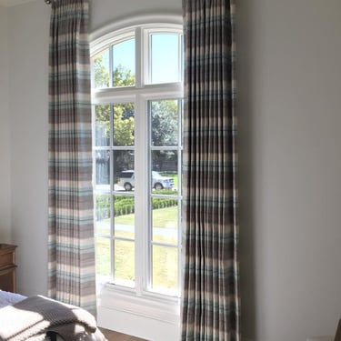 Custom Drapery Panels with horizontal stripe designer fabric on custom rod