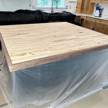 Handcrafted epoxy bar top with a unique resin design, adding a stylish and durable focal point to any entertainment space.