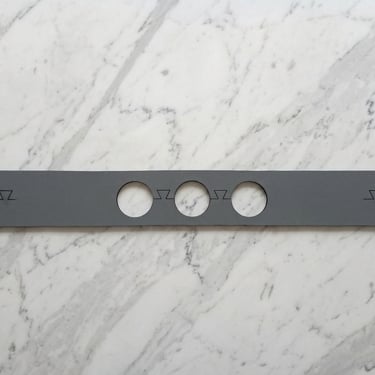 A standard kitchen faucet mat P/N 023 in grey color.