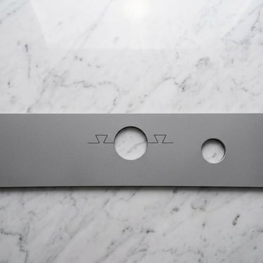 Custom kitchen faucet mat in grey color.