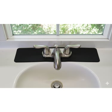A standard vanity faucet mat in black.