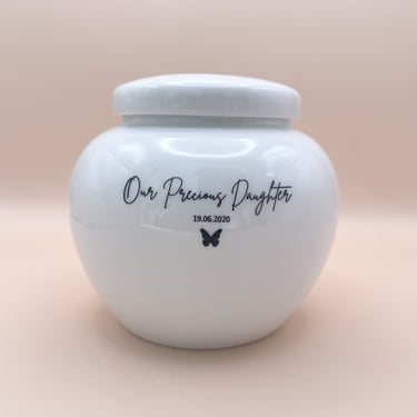 Personalised white ceramic baby urn engraved with baby's name