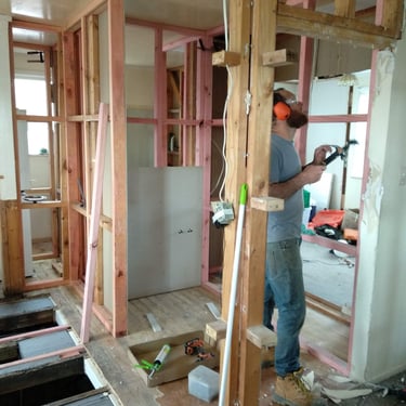an architect man in a construction site with a hammer hammer