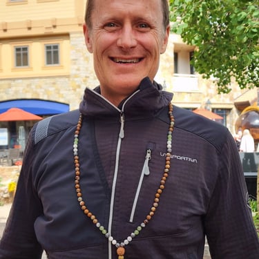 Man with his new Mala at the Bhav Booth