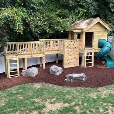 custom playhouse and play area created by The King's Garden