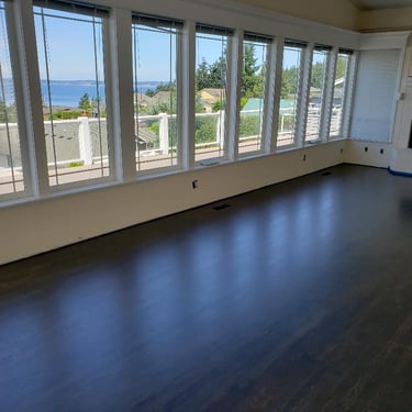 Vision Flooring finished hardwood floors in a nice waterfront home.