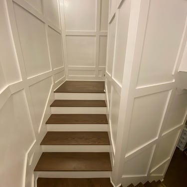 Vision Flooring LLC installed new solid oak stairs as well as wall panels on the walls. 