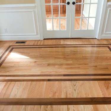 Vision Flooring and More, entrance with border made from Brazilian cherry wood.