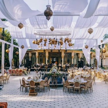 "Wedding decoration setup with veils and hanging lanterns creating an elegant ambiance.