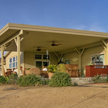 Large heavy wood patio structure with finished ceiling.