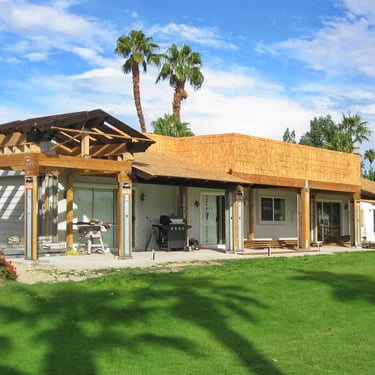 Outdoor living area being constructed around a 1973 mobile home.