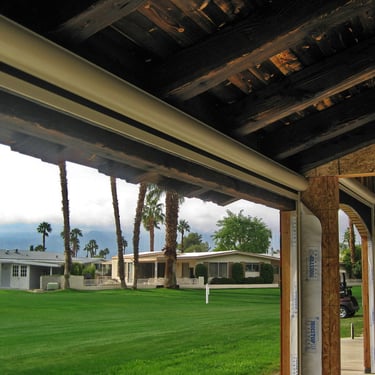 Rood structure with distressed lumber and hidden drop shades.
