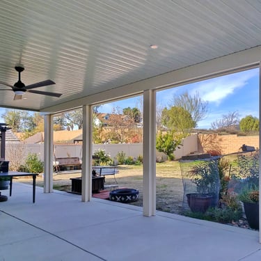 Alumawood patio structure in large backyard.