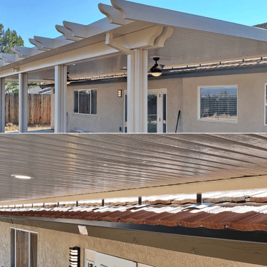 Roof mounted patio cover on tile roof.